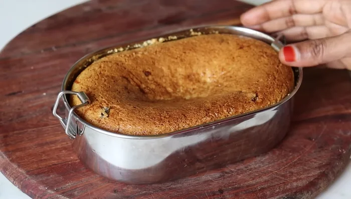 Let the cake cool completely before removing it from the tray. Carefully transfer it to a plate.