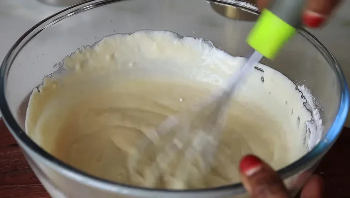 In a bowl, prepare your baking tray/tin. Line it with a butter sheet and grease with ghee or oil.