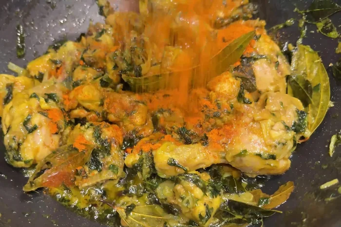 Add chili powder, coriander powder, salt, fenugreek leaves, ginger-garlic paste, and coconut powder. Mix well.