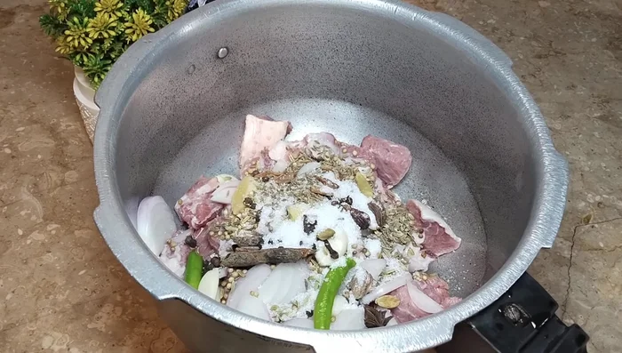 Add salt and 1.5 litres of water. Pressure cook for 30 minutes, or until the beef is tender. Check and pressure cook again if needed.
