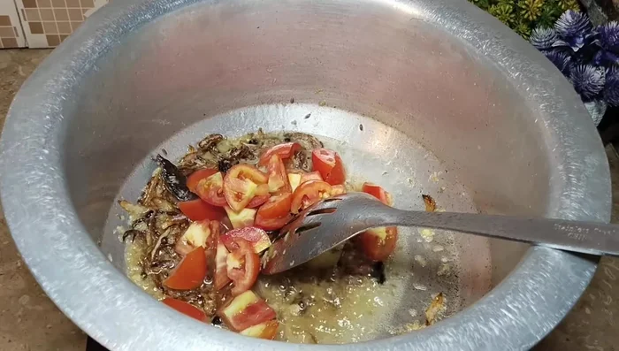 Add roughly chopped tomatoes and cook for 2-3 minutes until softened. Add garam masala and salt to taste (adjusting for salt already added to yakhni).