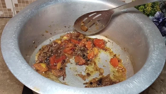Add the cooked beef and whipped curd. Cook until the curd water evaporates and the beef is lightly roasted (1-2 minutes).