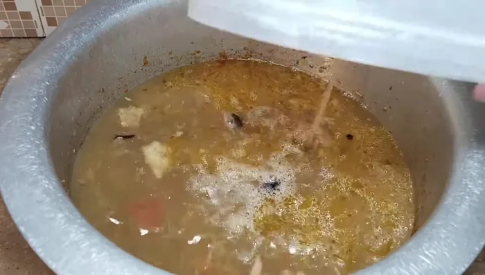 Add the yakhni (broth). Add soaked basmati rice. Adjust the amount of liquid (yakhni or water) based on the rice type; generally 2 cups of liquid for 1 cup of rice (adjust for rice quality).