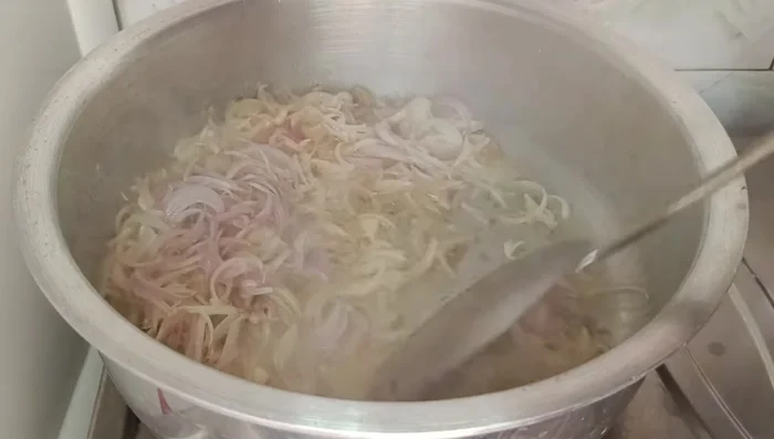 Add finely chopped onions and fry lightly until translucent.