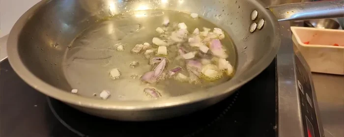 Add chopped onions and sauté until slightly softened. (55.6)