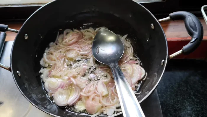 Add brinjal and doodi to the onions. Do not add sour ingredients yet. (307.6)