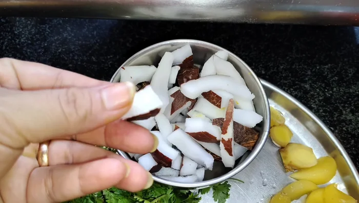 Chop or grate coconut. Wash and prepare coriander, green chilies, garlic, ginger. (55.039)