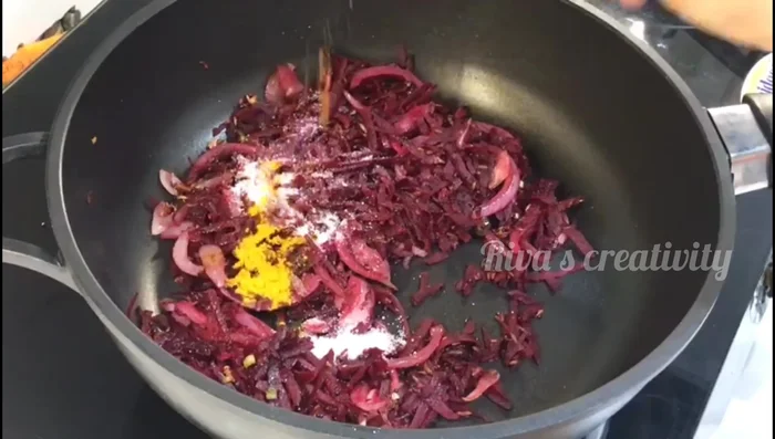 Add salt, turmeric powder, coriander powder, dry mango powder, and the prepared spice mixture. Cook for 30-40 seconds.