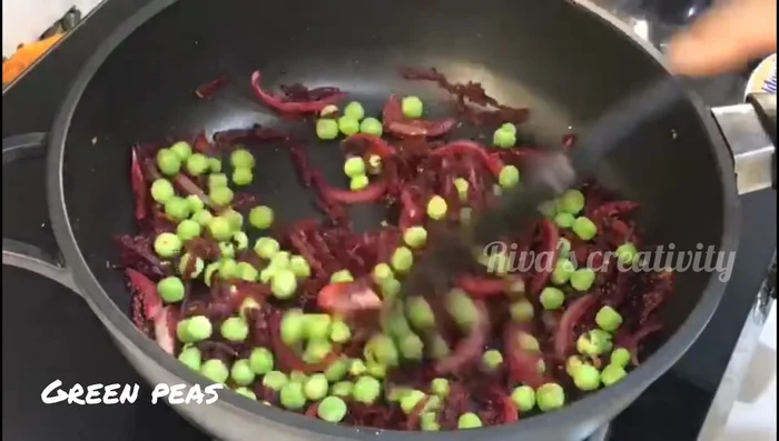 Add fresh peas and red chili powder. Cook until peas are soft.