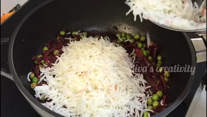 Add boiled rice and mix well. Cook uncovered on low flame for 3-4 minutes.
