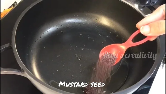 Add mustard seeds and cumin seeds to the ghee and let them crackle.