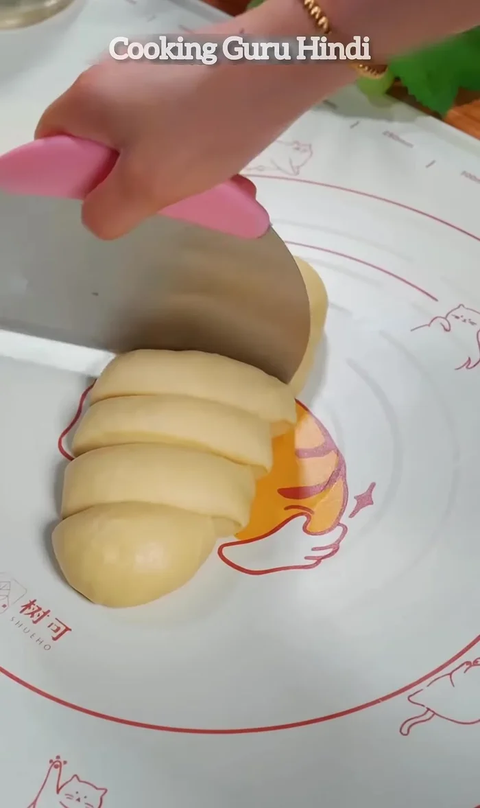 Divide the dough into six equal parts and knead them into round balls.
