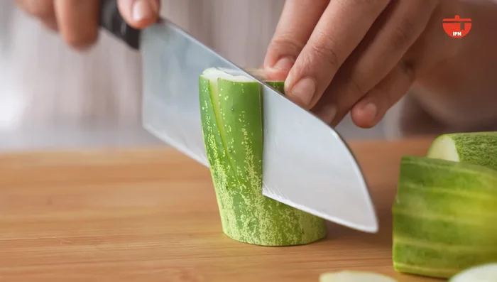 Dice fresh cucumbers into small bite-sized pieces.