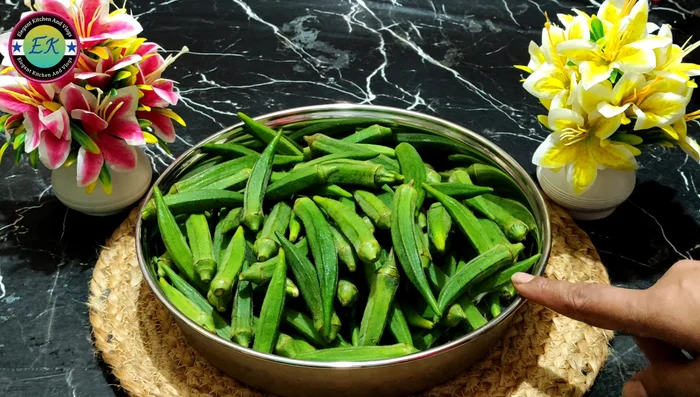 Wash the okra thoroughly with 3-4 changes of water. Wipe clean with a cotton cloth. Chop each okra into four parts and remove the seeds.