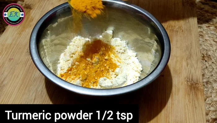 In a bowl, mix together cornflour, lentil flour, turmeric powder, Kashmiri red chili powder, coriander powder, cumin powder, amchur powder, red chili powder, and salt.