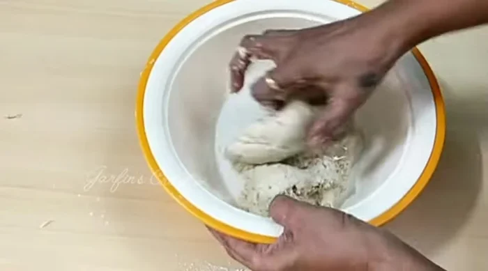 Add 1 tablespoon of vegetable oil to the dough and knead for 5-7 minutes until smooth and elastic.