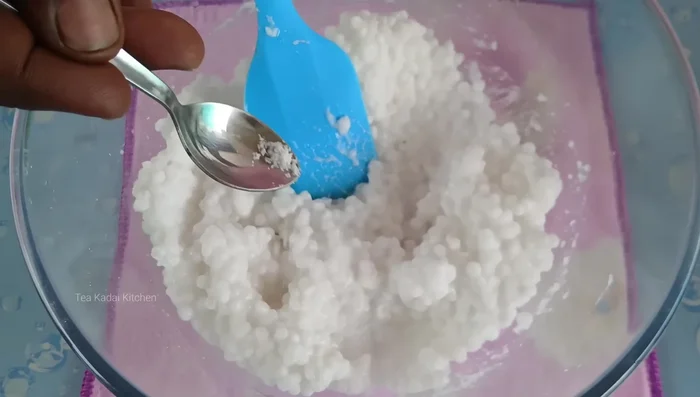 Mix the marinated rice with a pinch of salt, 1 tablespoon of jaggery, and 1-2 tablespoons of milk powder.