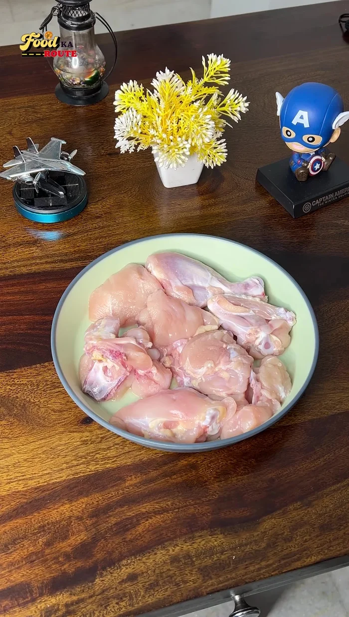 Wash and cut the chicken into bite-sized pieces to ensure proper masala absorption.