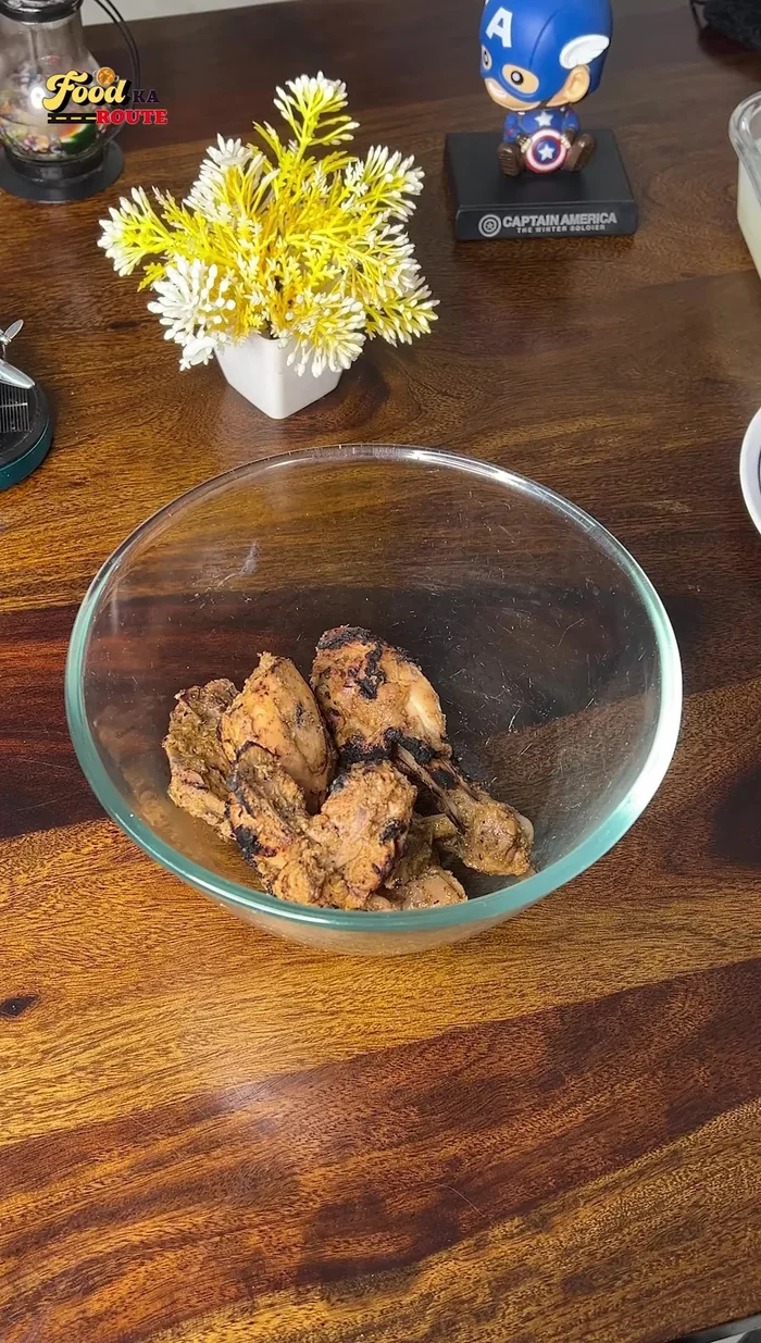 Optional: For a smoky flavor, place a bowl with burning coal in the center of a larger bowl containing the chicken and gravy. Pour ghee over the coal and cover for 5-10 minutes.