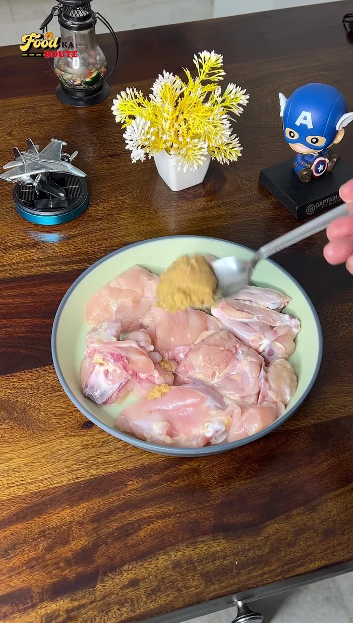 Marinate the chicken with ginger-garlic paste, salt, red chili powder, cumin powder, chaat masala, black pepper powder, garam masala, tikka masala, lemon juice, curd, and oil. Marinate for at least an hour, preferably overnight.