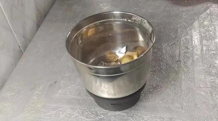 Grind ginger and green chilies in the same mixer jar.