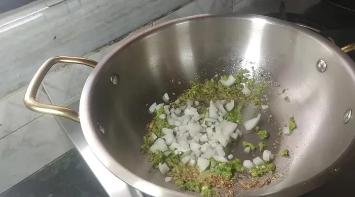 Add finely chopped onion and fry until translucent. Add finely chopped capsicum (or any other vegetable of your choice).