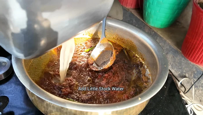 Add stock water and fry for another 5 minutes.