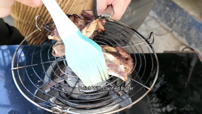 Roast the mutton pieces gently applying desi ghee (clarified butter).