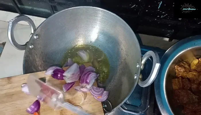 Add the marinated pork to the pan and mix well.