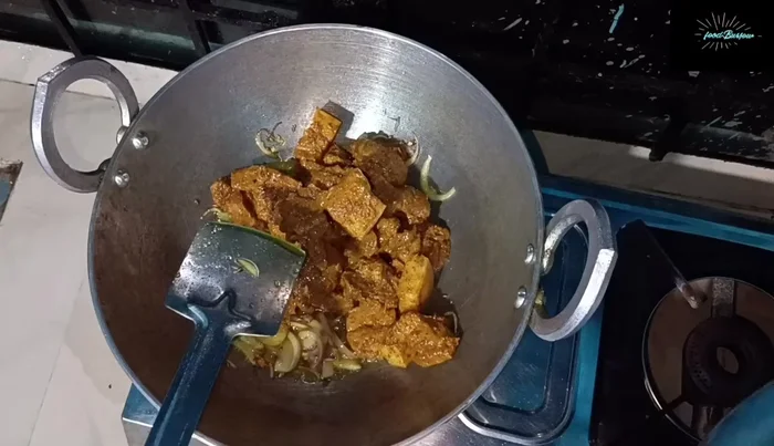 Add the chopped onions and chillies. Mix well and cook on low heat, covered.