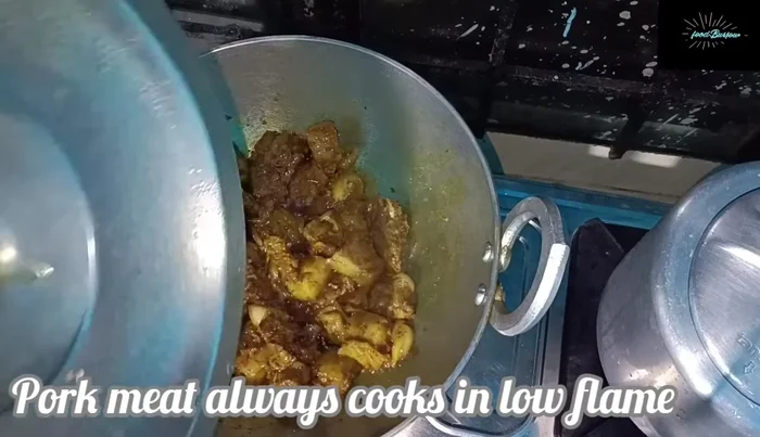 Continue cooking on low flame until the water is cooked well and the pork is tender.