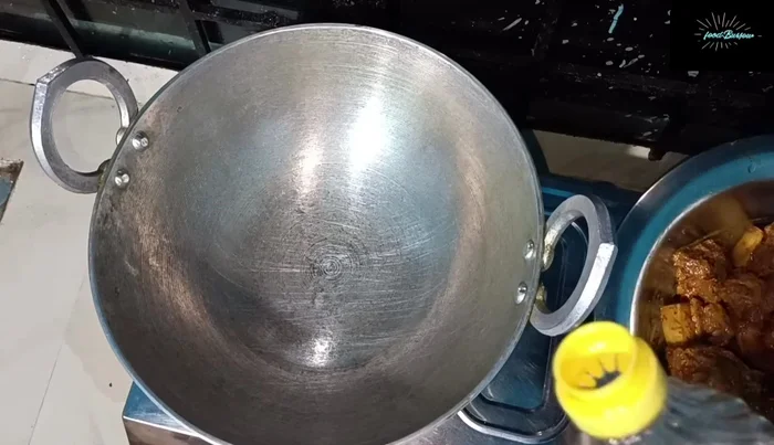 Heat mustard oil in a pan and add whole cumin seeds.