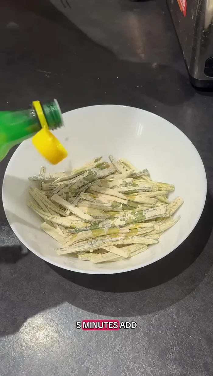 After 5 minutes, add lemon juice and a little water. Mix again to create crispy clumps.