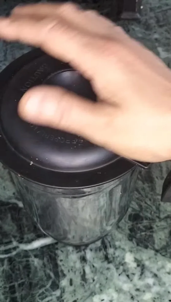 Add garlic to the mix and grind again until well combined.