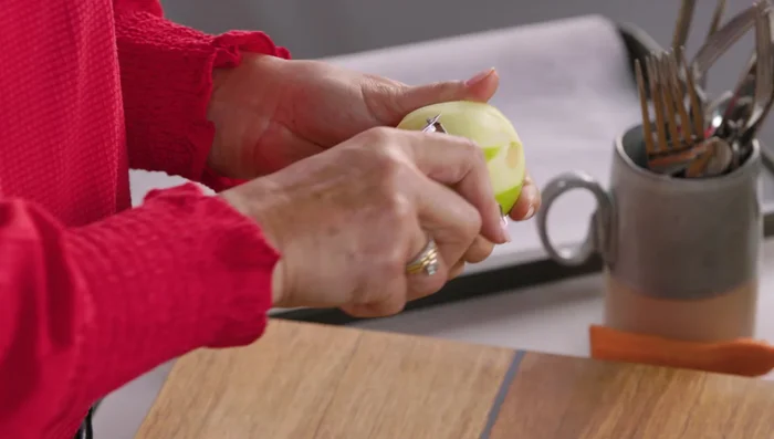Add diced apples, turmeric, cumin, coriander, and garam masala. Cook until the apples soften and release their juices.