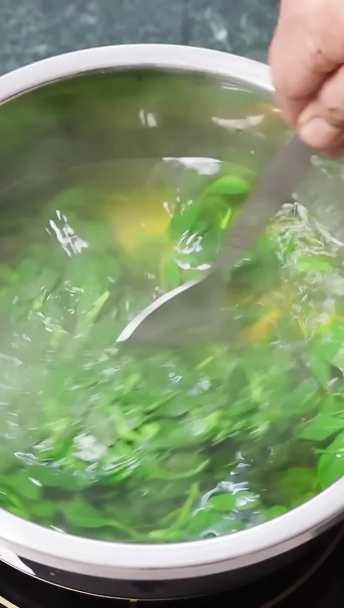 Transfer the fenugreek, ginger, garlic, and green chilies to a blender and grind to a fine paste.
