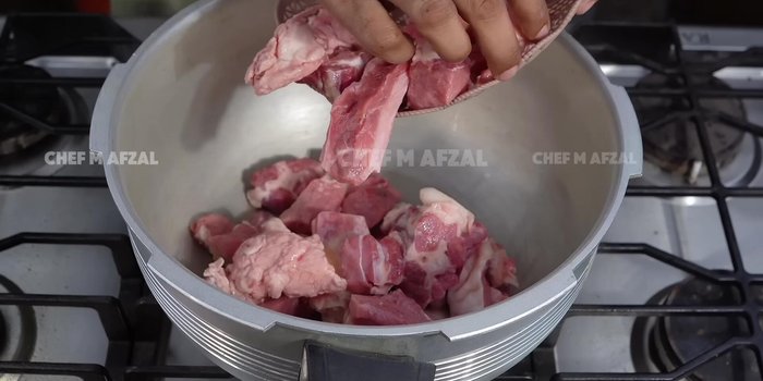 Cook the meat: Add meat, salt, ginger-garlic paste, and 2 liters of water to a pressure cooker. Cook for 15-20 minutes (depending on the meat).