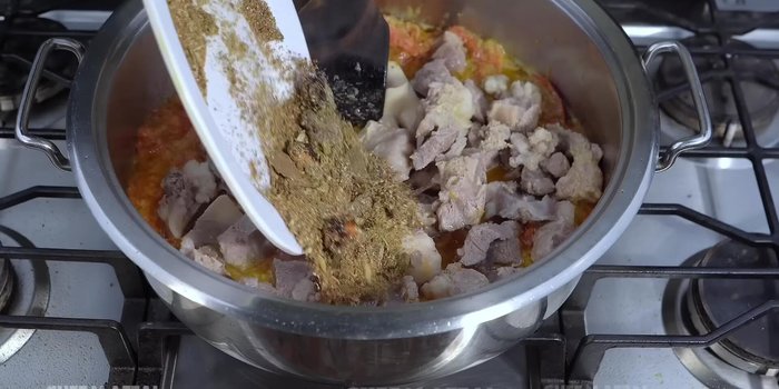 Add cooked meat, prepared masala, soaked tamarind, curd, salt, and Chinese salt to the pot. Roast for 2 minutes.
