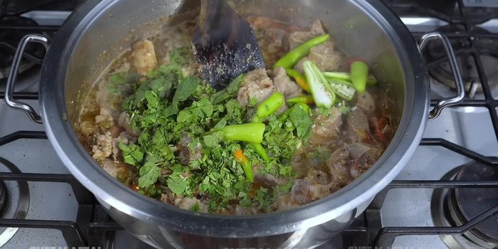 Add green chilies, coriander, and mint. Fry for 1 minute.