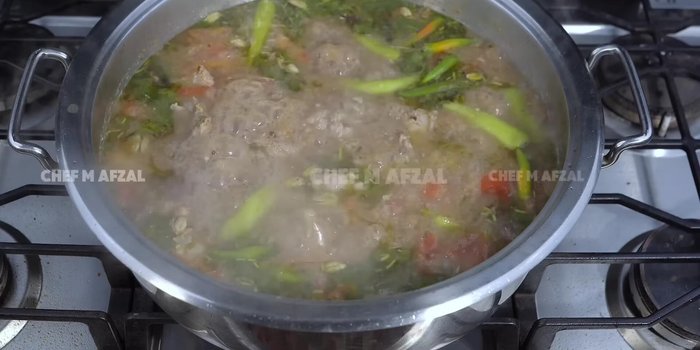 Add the soaked rice and gently mix. Once the yakhni boils rapidly, add rice and stir gently to avoid breaking the rice.
