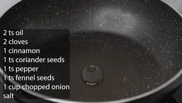 Heat a kadai and add 2 tsp of oil. Add cloves, cinnamon, coriander seeds, cumin seeds, and chili.