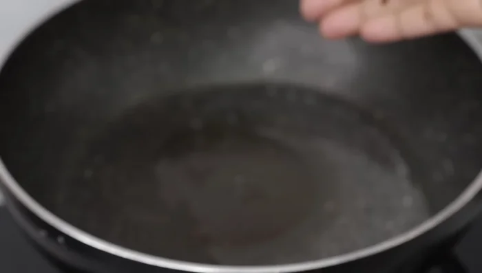 Add 1 cup of finely chopped large onion and a pinch of salt. Sauté until the onions change color.