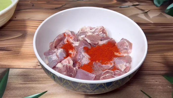 Marinate the mutton with red chili powder, turmeric powder, coriander powder, cumin powder, salt, garam masala powder, and curd for 20-30 minutes.