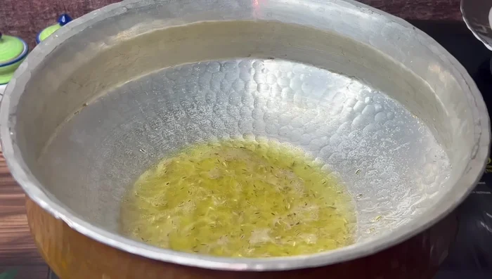 Add finely chopped onions and sauté until golden brown.