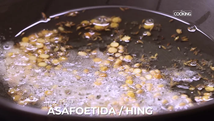 Add asafoetida powder, ginger, and garlic. Roast lightly until fragrant.