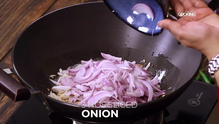 Add onions and green chilies. Sauté until onions are soft and translucent.