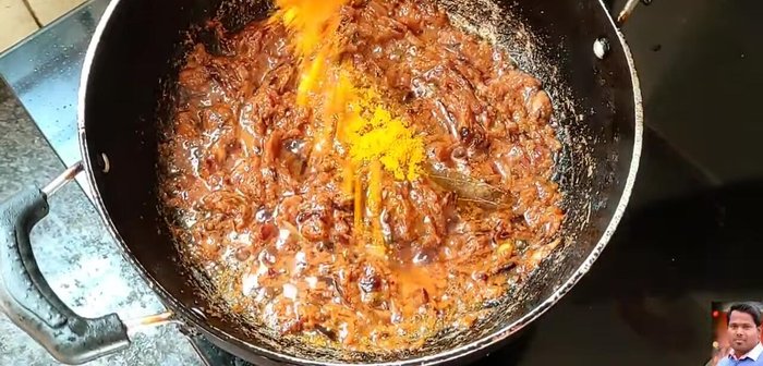 Add turmeric powder, red chili powder (adjust to taste), coriander powder, and cumin powder. Mix well.