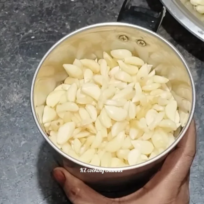 Grind the peeled garlic coarsely in a mixer/blender. Do not add any water.