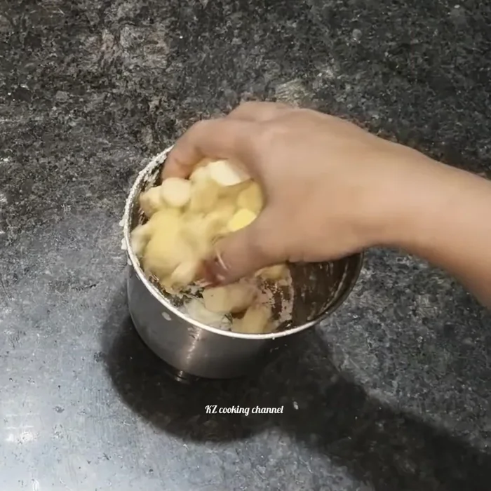 Grind the chopped ginger coarsely in the same mixer/blender. Do not add any water.