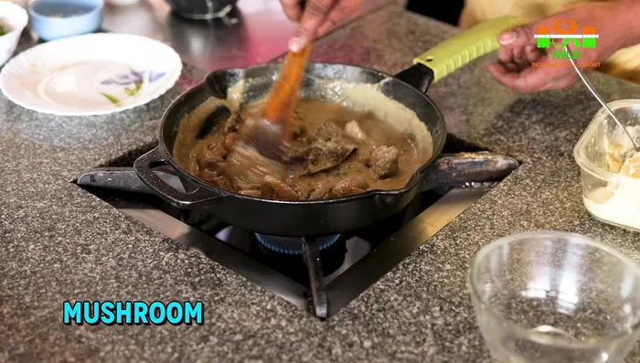 Add the fried mushrooms, cheese, and cream. Mix well until cheese melts. Stir in dried methi.